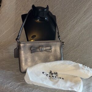 Coach Turnlock Bow Corner Zip Wristlet.